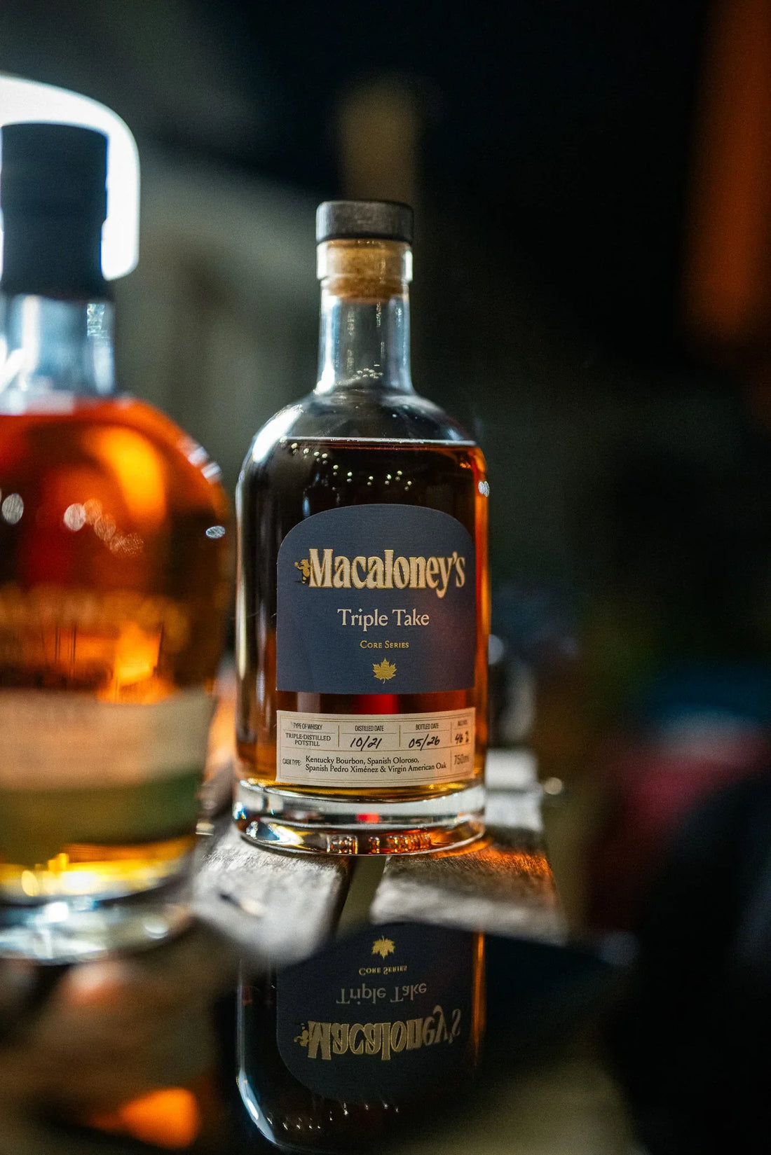 Macaloney's Triple Take, World's Best Pot Still, on a dark tasting table
