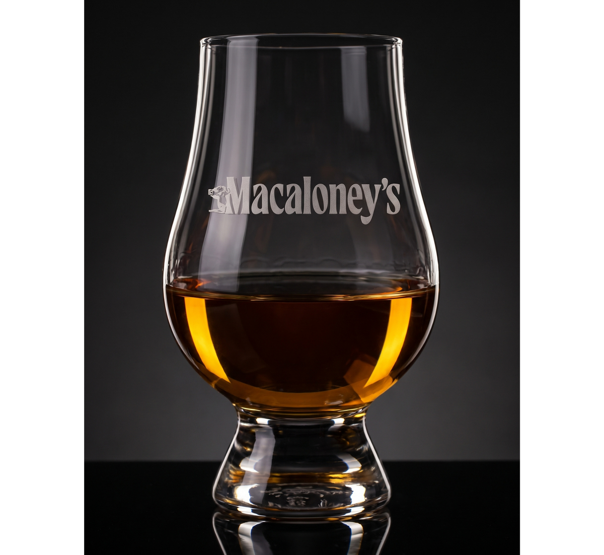 Macaloney's etched Glencairn with a dram, dark background