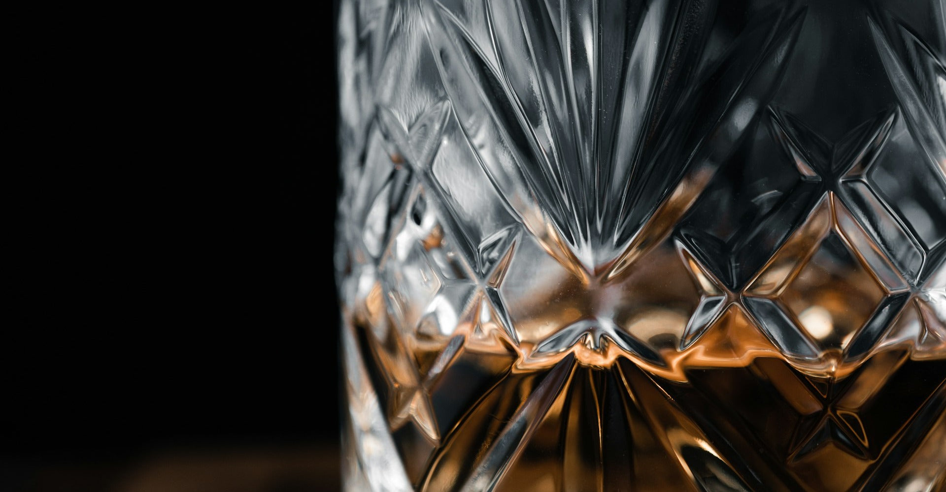 Golden whisky in cut crystal glass